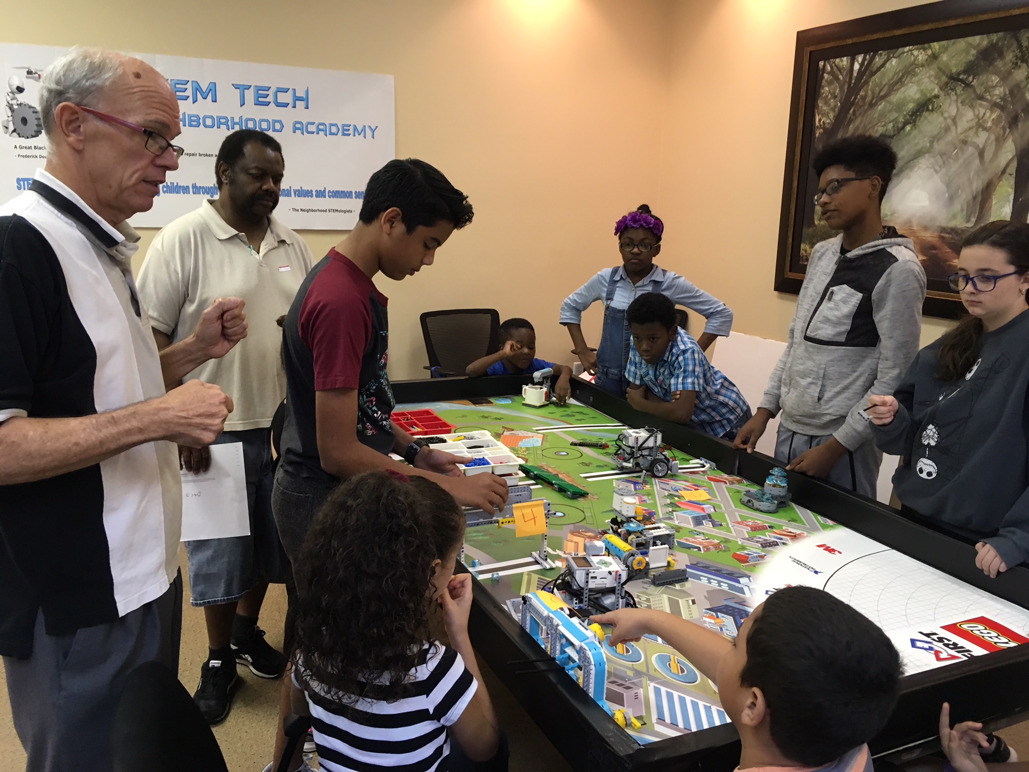 Students and instructor playing a board game together