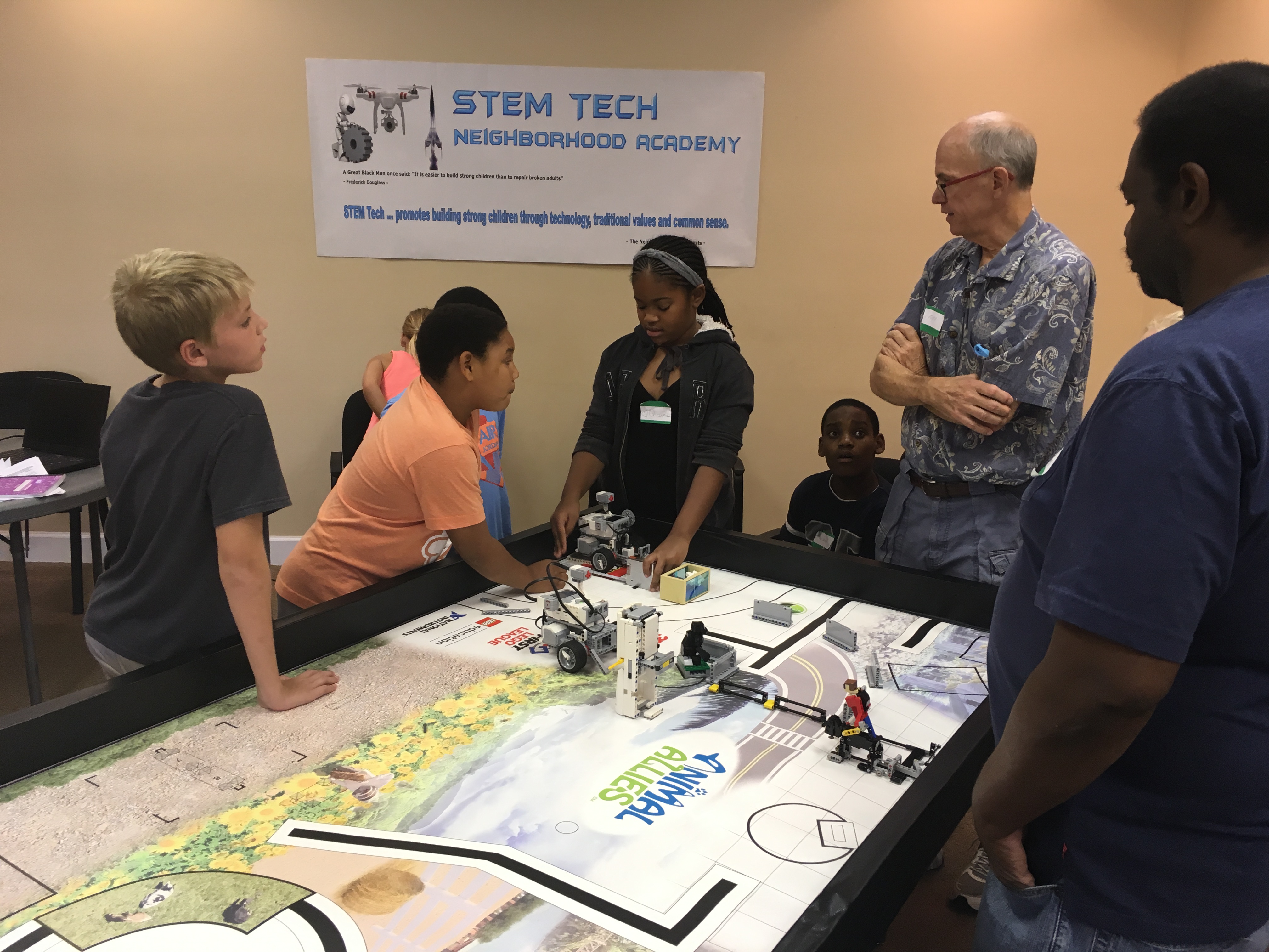 Students and instructor playing a board game together