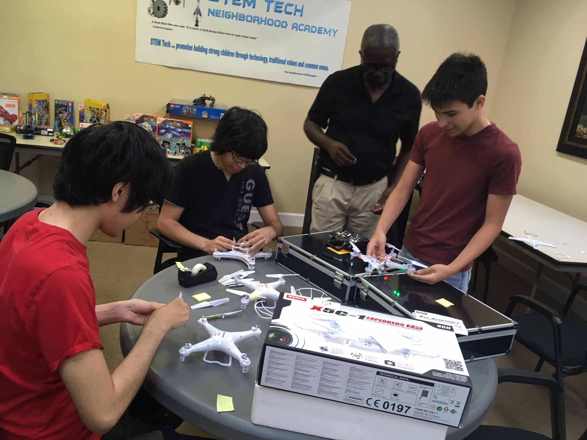 Students working on drone projects and learning together