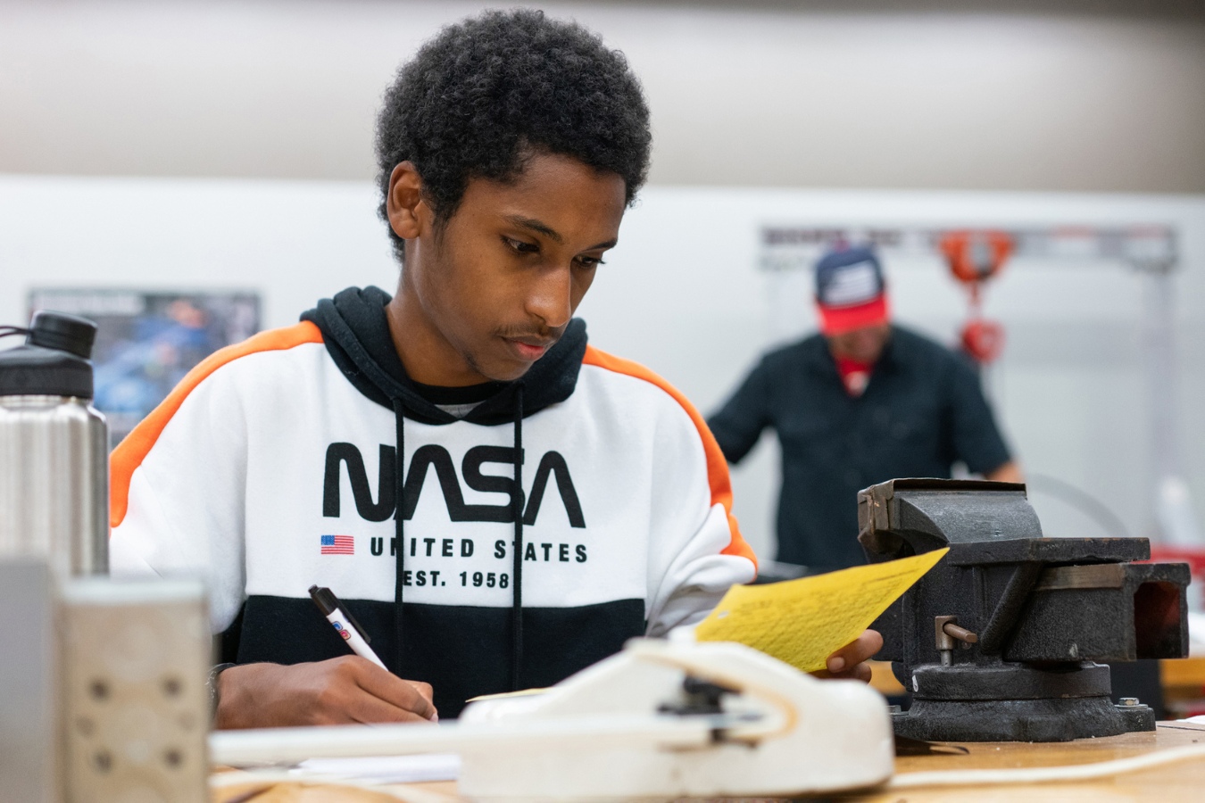 Focused student in EFSC's Aerospace Technician Certificate program contributing to project development.