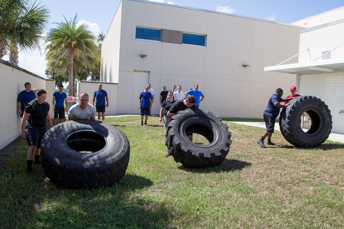Corrections Officer academy program students engage in outdoor PT at EFSC's Public Safety Institute, tackling an obstacle course with giant tires