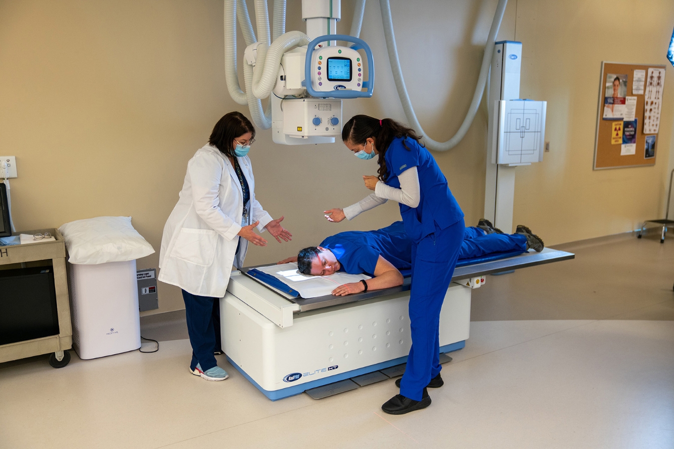 Students perfecting X-ray machine techniques and learning practical skills by working hands-on to ensure future success.