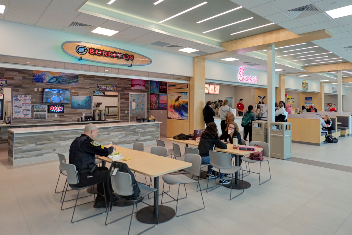 A diverse group of students enjoying food and conversation in the Student Union (Bldg. 16) on EFSC's Melbourne Campus.