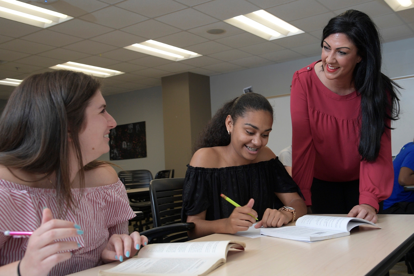 Educational interaction: Students attentively working with the instructor's guidance.