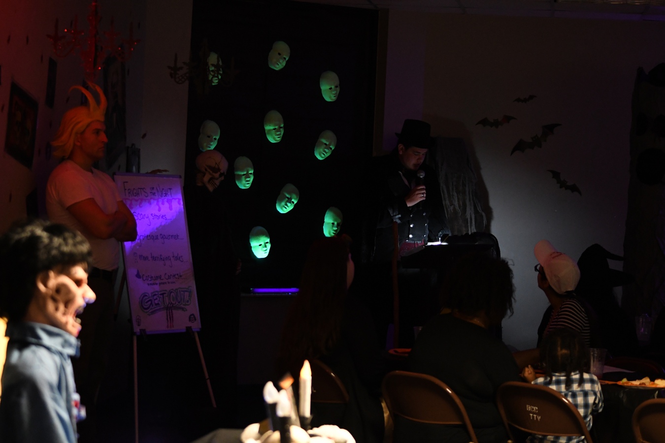 Student reading a written story at a Haunted Reading event