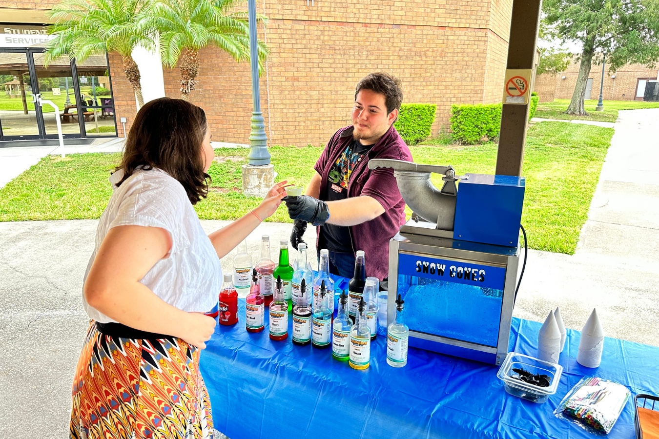 Student at a snow cone pop-up event