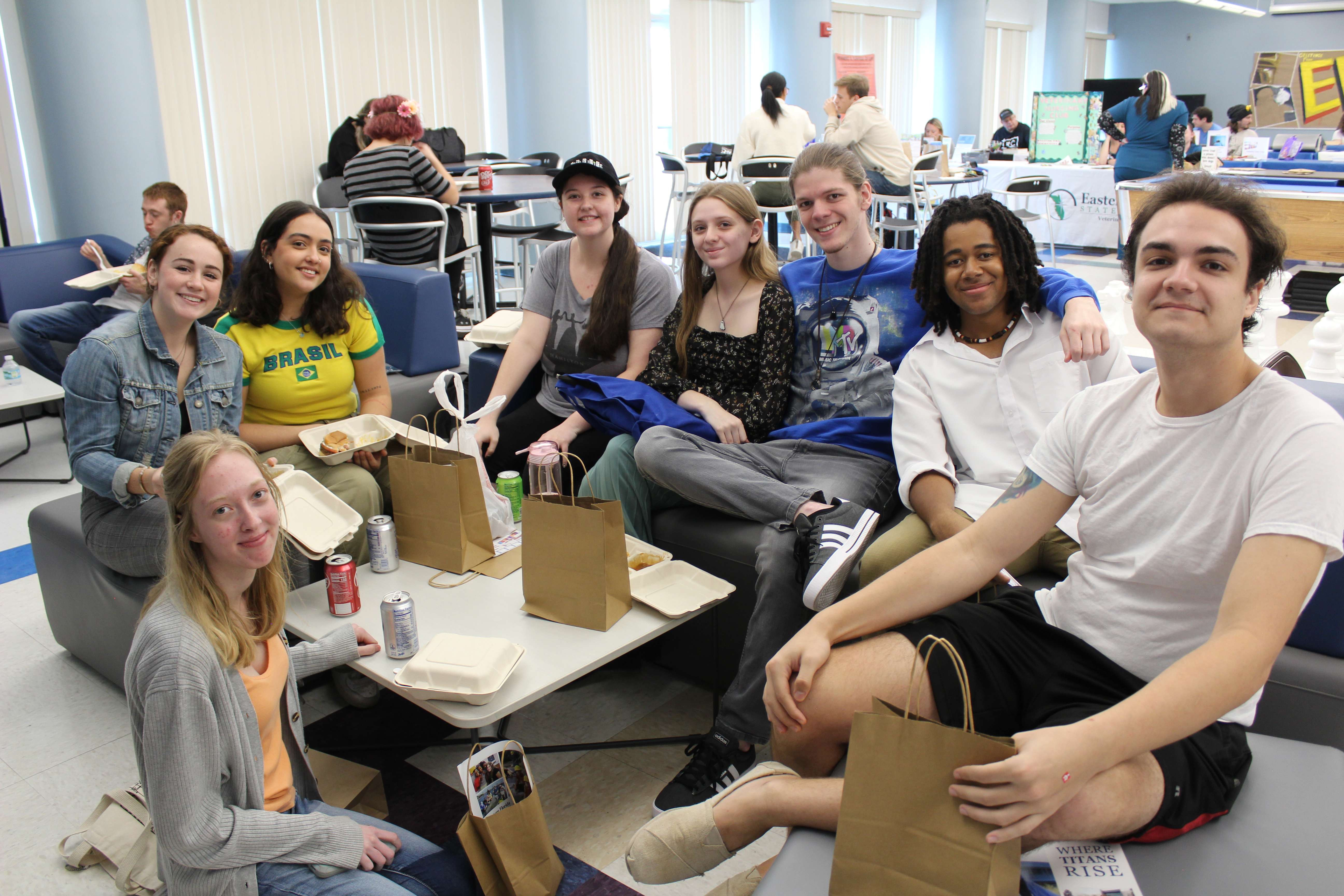 Group photo of students chilling in Bldg. 11 on the Cocoa Campus enjoying the free food from a student event.