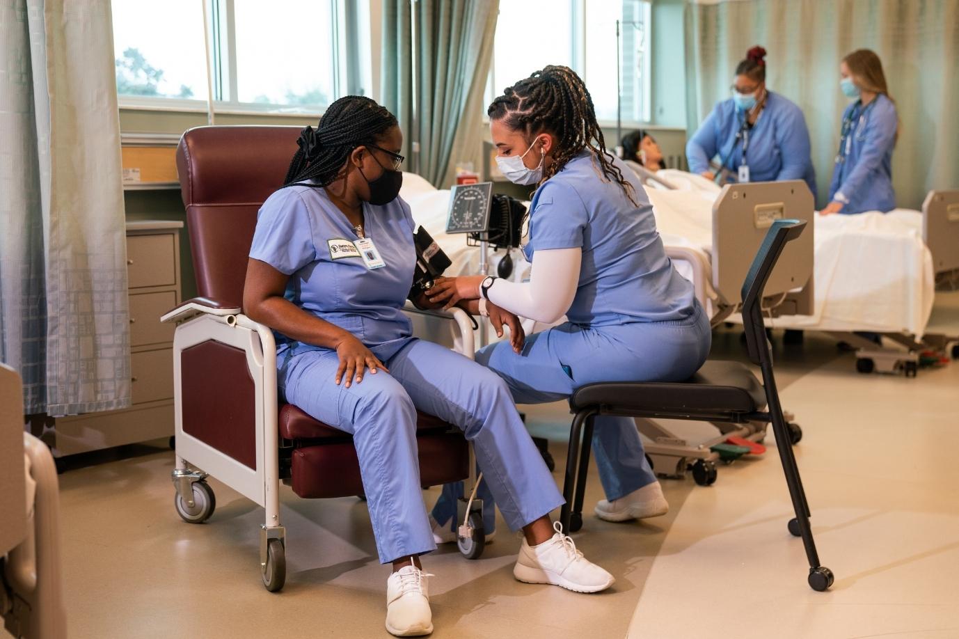 nursing students in a clinical lab