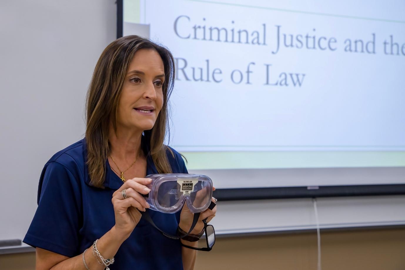 criminal justice instructor speaking in front of a class
