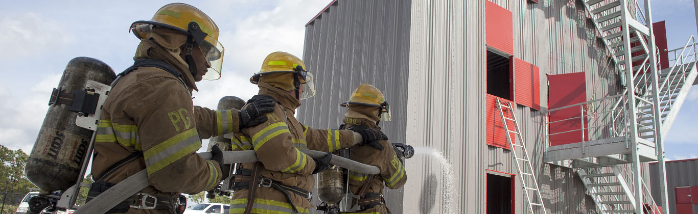 Fire fighter students with water hose at EFSC Fire Training Center