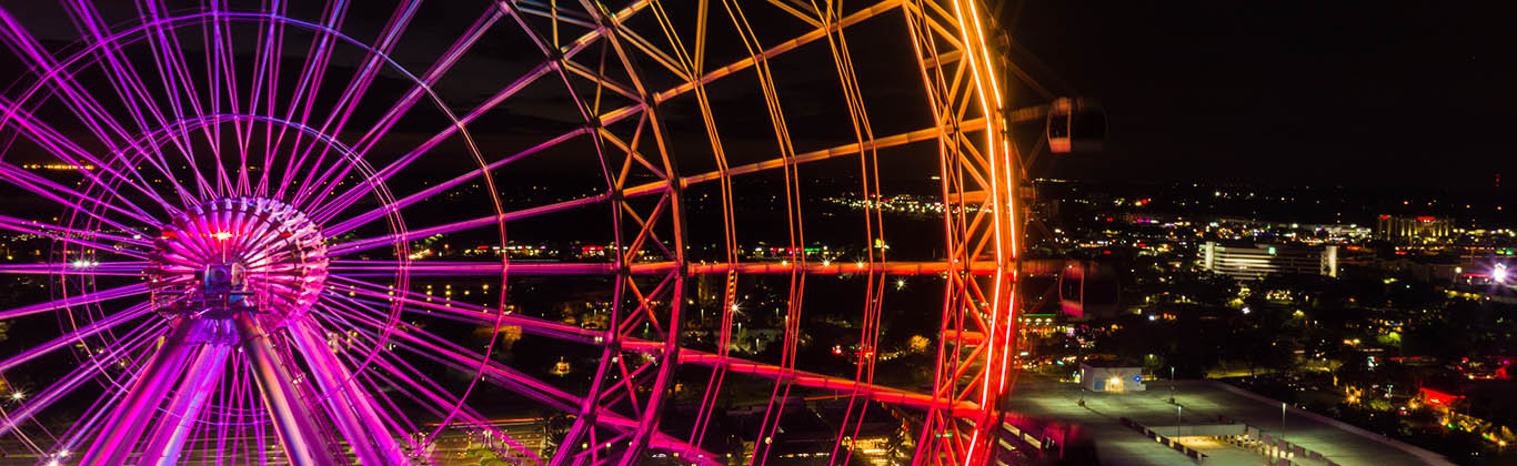 A ferris wheel with rainbow lights