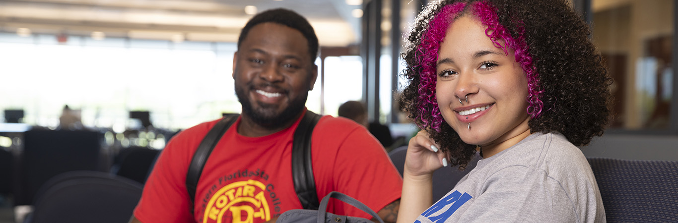 Male and female student in Melbourne Campus admissions.