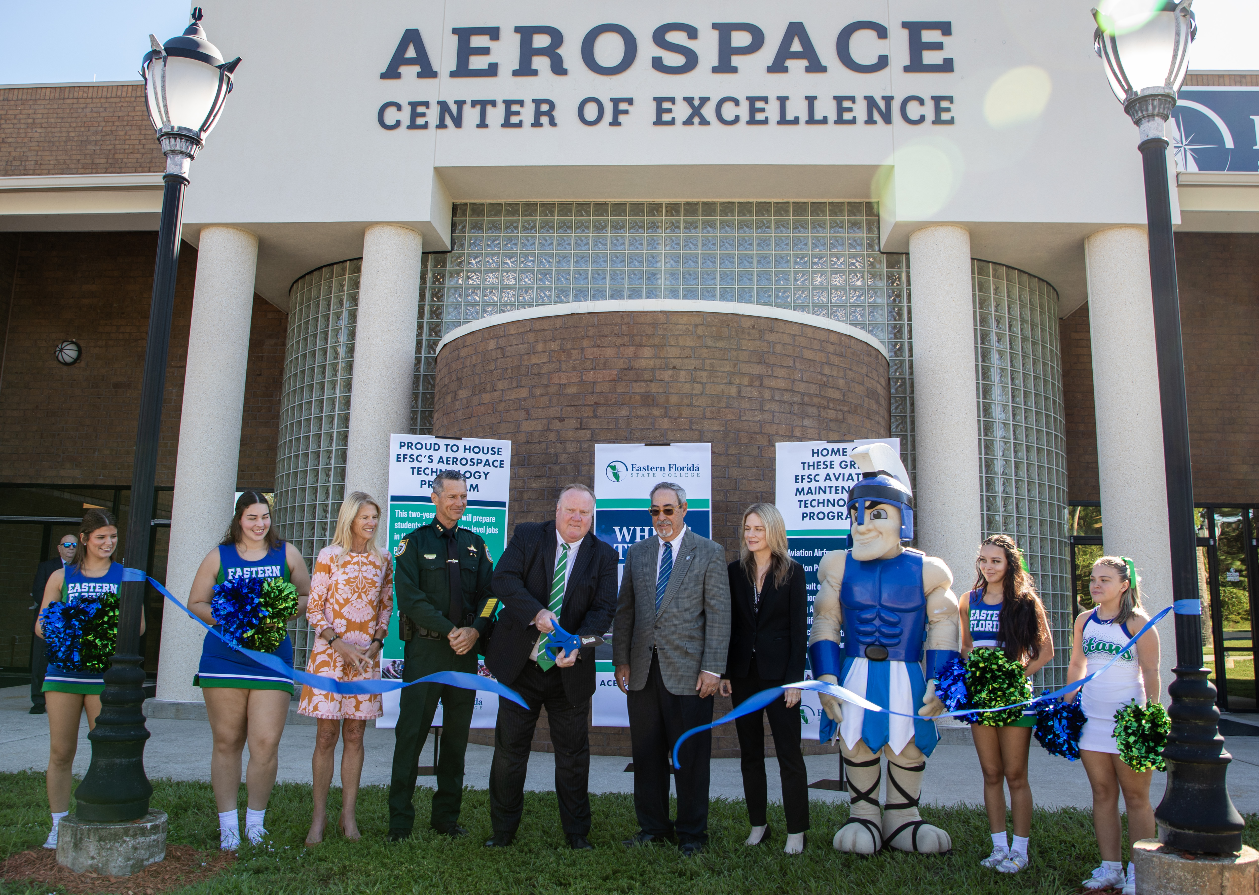 Ribbon cutting with President and Board of Trustees for ACE Building