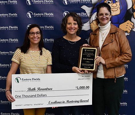 Excellence in Mentoring Honoree Beth Rountree (center) and Mentoring Steering Committee members Jessica Milford and Katina Gothard