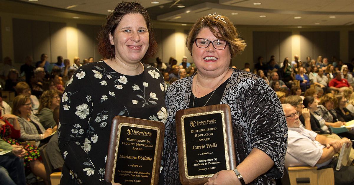 Marianne D'Altilio and Carrie Wells holding their awards