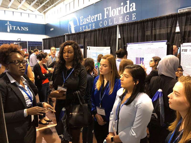 students at research poster session