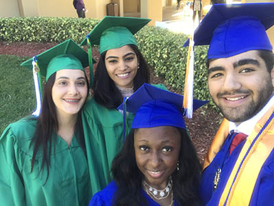 EFSC graduates in blue and green caps and gowns