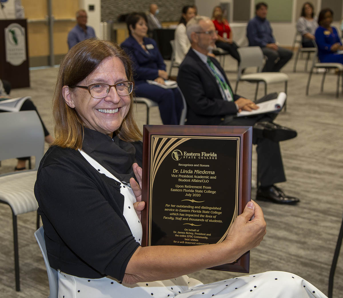 Dr. Linda Miedema with retirement plaque